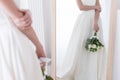 cropped view of bride in traditional dress with wedding bouquet looking at her reflection Royalty Free Stock Photo