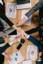 Cropped view of business partners shaking hands at table Royalty Free Stock Photo