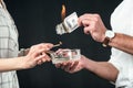 cropped view of businesspeople burning dollar banknotes, Royalty Free Stock Photo