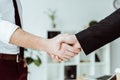 cropped view of businesspeople shaking hands Royalty Free Stock Photo