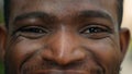 Cropped view close up male eyes African American smiling happy carefree man ethnic joyful male looking at camera Royalty Free Stock Photo