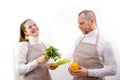 cropped view of female chef washing hands over sink while colleague cooking on background in restaurant kitchen Royalty Free Stock Photo