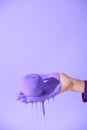 cropped view on female hand holding apple in purple paint, Royalty Free Stock Photo