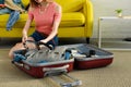 cropped view of girl packing goggles and snorkeling fins into suitcase Royalty Free Stock Photo