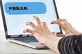 Cropped view of girl typing on laptop keyboard with fresk message on screen, cyberbullying concept.