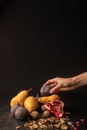 cropped view of hand with organic autumnal fruits
