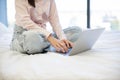 Cropped view of hands typing on modern wireless laptop of young woman. Royalty Free Stock Photo