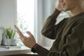 Cropped view of happy young asian man checking social media, texting message on mobile phone Royalty Free Stock Photo