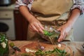 Cropped view of a housewife pickling cucumbers in home kitchen. Autumn canning of seasonal vegetables for the winter Royalty Free Stock Photo