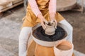 cropped view of kid making ceramic pot on pottery wheel Royalty Free Stock Photo