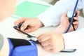 Cropped view of male doctor checking blood pressure of patient at table Royalty Free Stock Photo