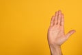 Cropped view of male hand showing cyrillic letter from sign language