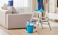 Cropped view of man climbing ladder to clean ceiling. Cleaning service concept Royalty Free Stock Photo