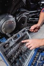 partial view of technician hands examining