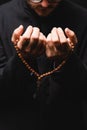 Cropped view of pastor holding rosary Royalty Free Stock Photo
