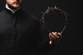 Cropped view of pastor holding wreath Royalty Free Stock Photo
