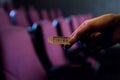 cropped view of person holding cinema ticket