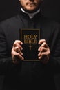 Cropped view of priest holding book Royalty Free Stock Photo