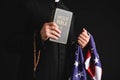 Cropped view of priest holding holy Royalty Free Stock Photo