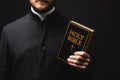 Cropped view of priest holding holy Royalty Free Stock Photo