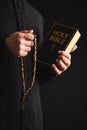 Cropped view of priest holding holy Royalty Free Stock Photo