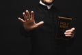 Cropped view of priest holding holy Royalty Free Stock Photo