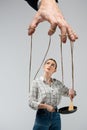 Cropped view of puppeteer manipulating girl Royalty Free Stock Photo