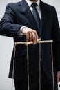 Cropped view of puppeteer in suit Royalty Free Stock Photo