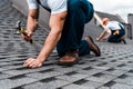 View of repairmen in uniform working on rooftop Royalty Free Stock Photo