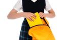 Cropped view of schoolgirl putting book