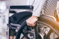 Cropped view of senior woman hands holding on wheelchair at home Royalty Free Stock Photo