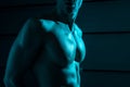 View of sexy shirtless muscular man in darkness Royalty Free Stock Photo