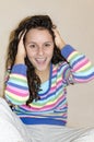 Cropped view of surprised young brunette woman with courly hairand wide-open mouth Royalty Free Stock Photo