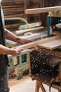 cropped view of tattooed carpenter working