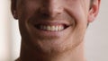 Cropped view unrecognizable Caucasian man smile toothy male teeth smiling happy joyful carefree cheerful guy home