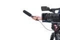 cropped view of video camera and female hand with microphone, Royalty Free Stock Photo