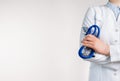 Cropped view of Woman Doctor in uniform standing and holding a stethoscope. Copy space Royalty Free Stock Photo