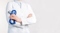 Cropped view of Woman Doctor in uniform standing and holding a stethoscope. Copy space Royalty Free Stock Photo