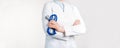 Cropped view of Woman Doctor in uniform standing and holding a stethoscope. Copy space Royalty Free Stock Photo