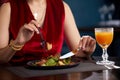 Cropped view of woman eating fresh salad for lunch in luxury restaurant, Healthy lifestyle, diet concept