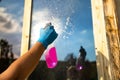 Cropped view of woman hand equipment for washing and cleaning the window from the outside Royalty Free Stock Photo