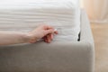 Woman opened fastener, changing protective cover on the mattress Royalty Free Stock Photo
