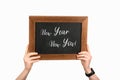 Cropped view of woman hands holding board with lettering new year new you Royalty Free Stock Photo
