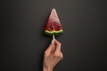 Cropped view of woman holding watermelon