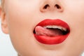 View of woman with red lipstick licking lips isolated on white Royalty Free Stock Photo