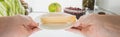 Cropped view of woman taking cheese from fridge with food  on white, panoramic shot Royalty Free Stock Photo