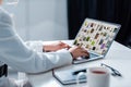 Cropped view of woman using laptop with pinterest website on screen Royalty Free Stock Photo