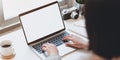 Cropped view of young businesswoman typing on blank screen laptop Royalty Free Stock Photo