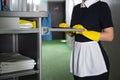 cropped view of young chambermaid in Royalty Free Stock Photo