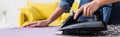 Cropped view of young woman ironing Royalty Free Stock Photo